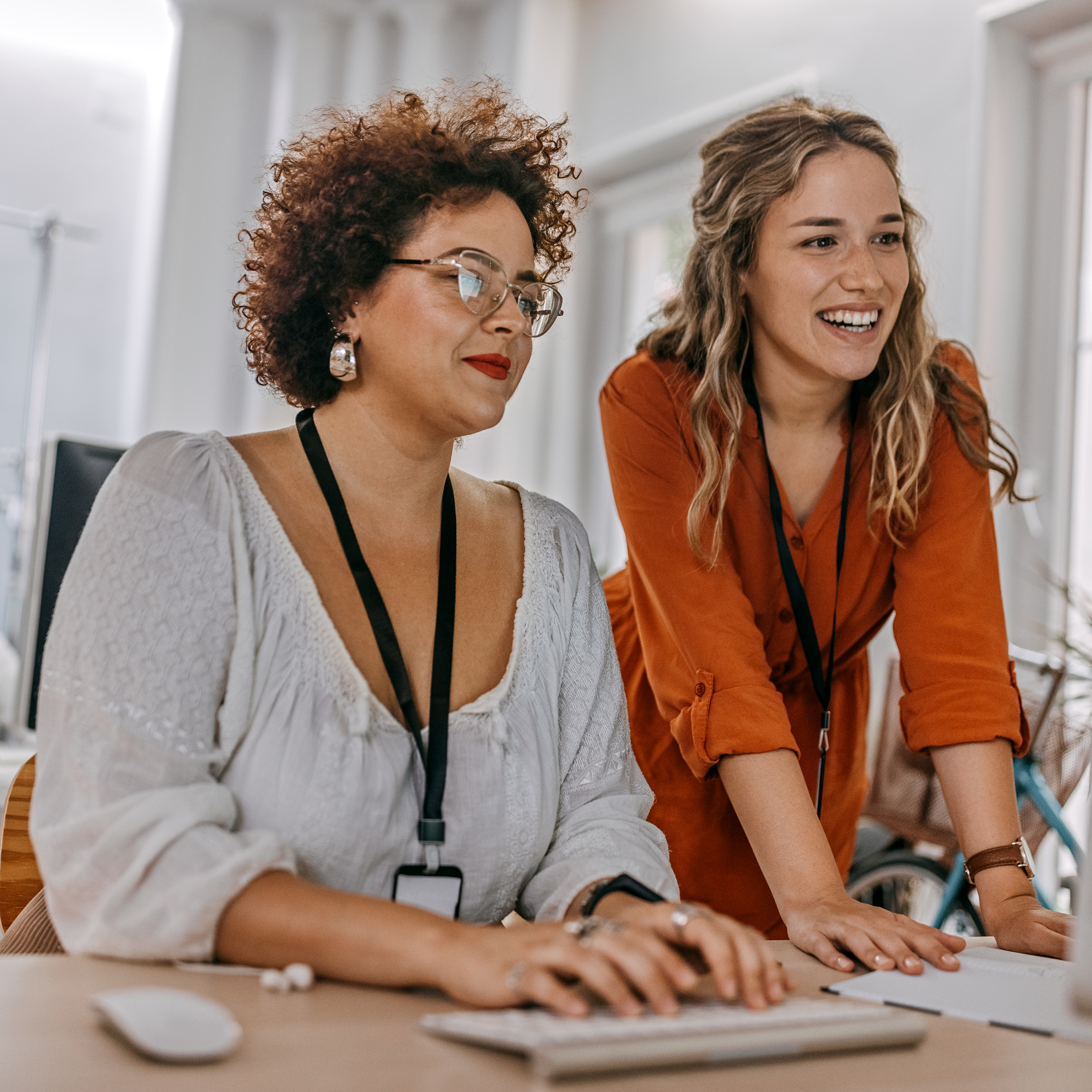 Women completing a workplace wellness assessment
